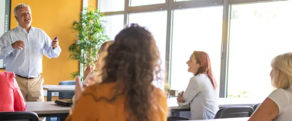 A teacher speaking to a classroom of students